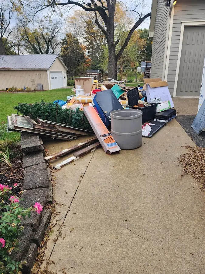Dumpster being loaded with debris for Residential Dumpster Rental in Clearfield